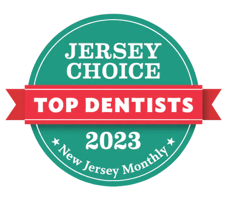 Jersey Choice Top Dentists 2023 badge awarded by New Jersey Monthly magazine with teal and red design