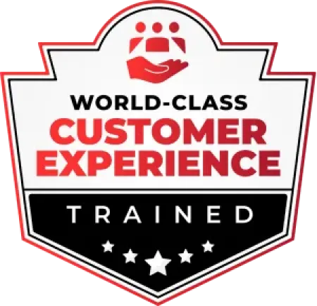 Shield badge with red and black text stating world-class customer experience trained with icons and stars.
