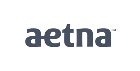 Aetna logo in dark blue lowercase letters on a transparent background