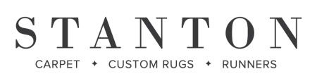 Stanton logo with text highlighting carpet, custom rugs, and runners services in black font.