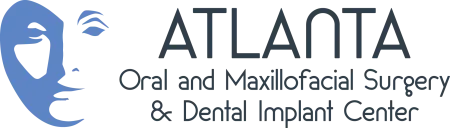 Logo of Atlanta Oral and Maxillofacial Surgery and Dental Implant Center with face illustration and text