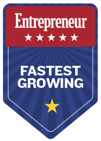 Entrepreneur fastest growing award badge with red, blue, and white colors featuring stars and bold text.