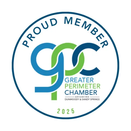 Greater Perimeter Chamber 2025 proud member logo featuring blue and green intertwined letters in a circular design.