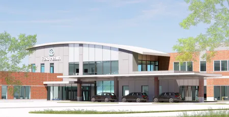 a building with cars parked in front