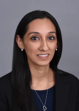 a woman smiling and posing for the camera