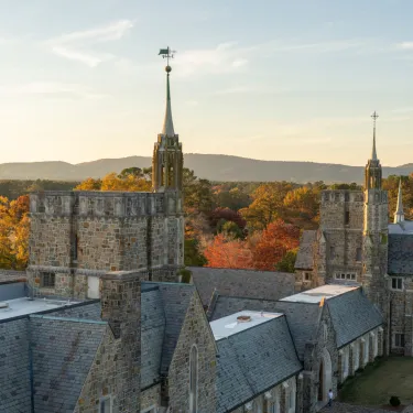 a large stone building with a tall tower