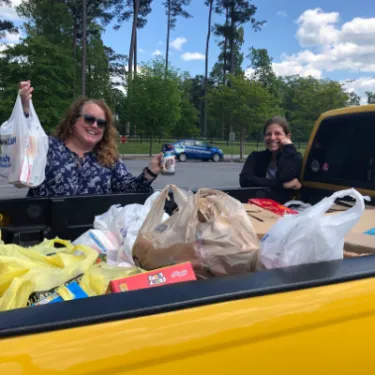 Berry staff put food in truck for Virtual Work Week