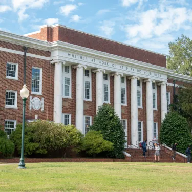 a large brick building with columns