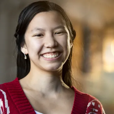 Girl in Red Sweater Smiling