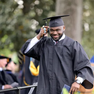 Graduate walks across stage in cap and gown Berry College Class of 2021