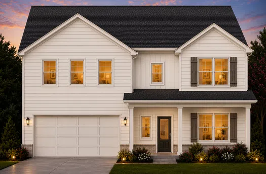 Modern two-story white house with black roof, illuminated windows, and sunset sky background