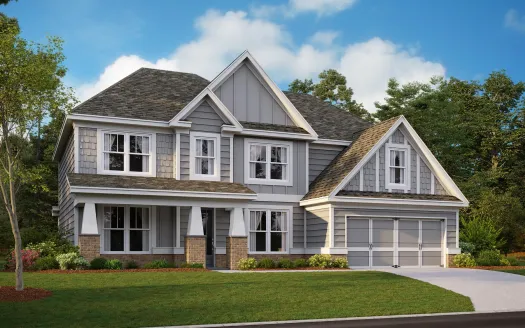 a large house with many windows and a grey exterior