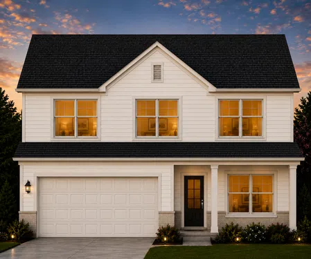 Modern two-story white house with black roof and warm-lit windows at sunset with landscaped front yard.