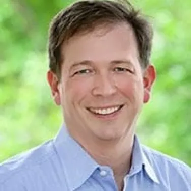 a man smiling for the camera