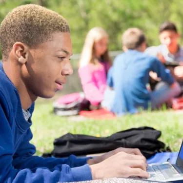 a boy using a laptop