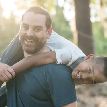 a man holding a child