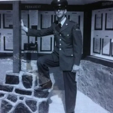 a man standing in front of a building