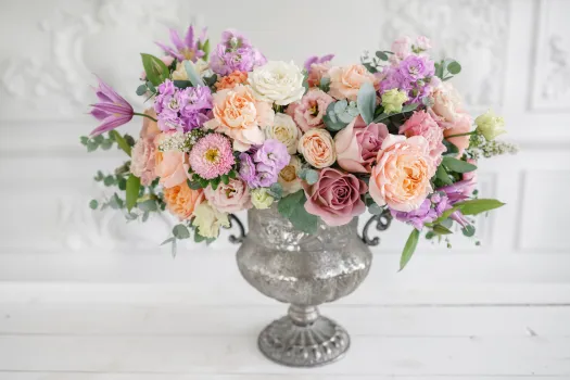 a bouquet of flowers in a vase on a table