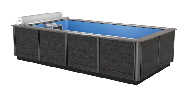 Rectangular above ground swimming pool with dark wood paneling and blue interior, featuring a pool cover system.