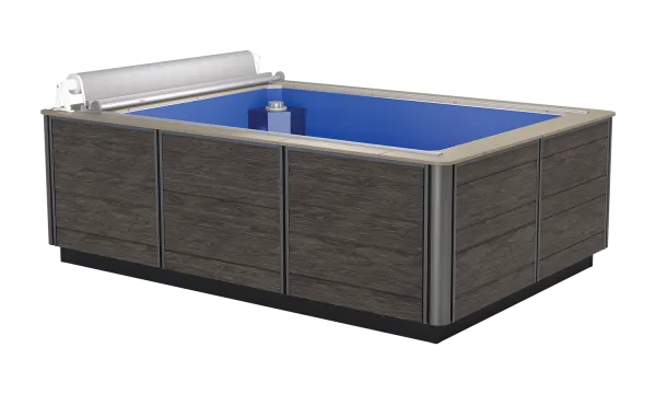 Rectangular above-ground pool with wood panel exterior and blue interior, featuring a white pool cover roll.