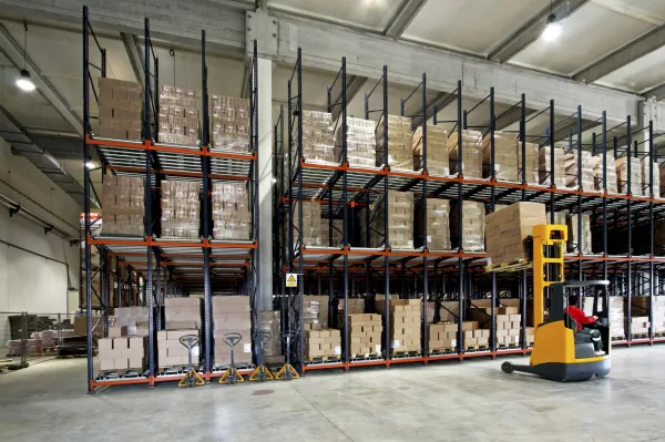 a warehouse with shelves and equipment