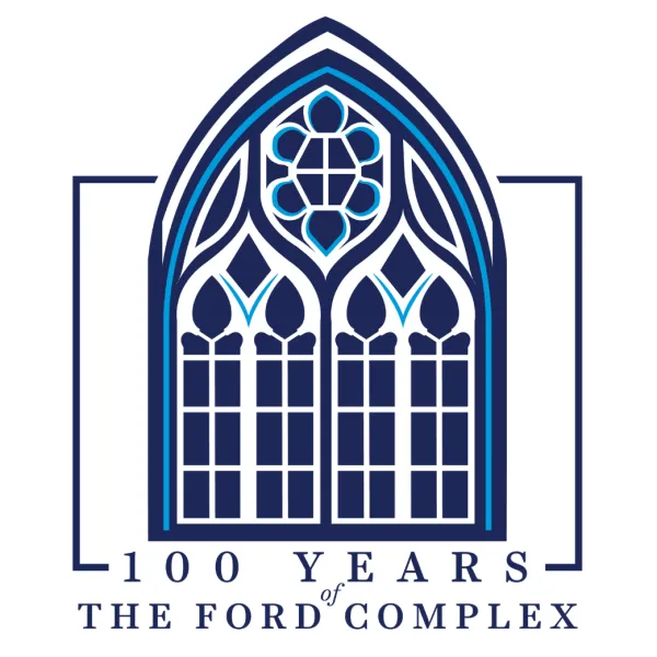 Blue and white stained glass window design celebrating 100 years of The Ford Complex with elegant arch framing.
