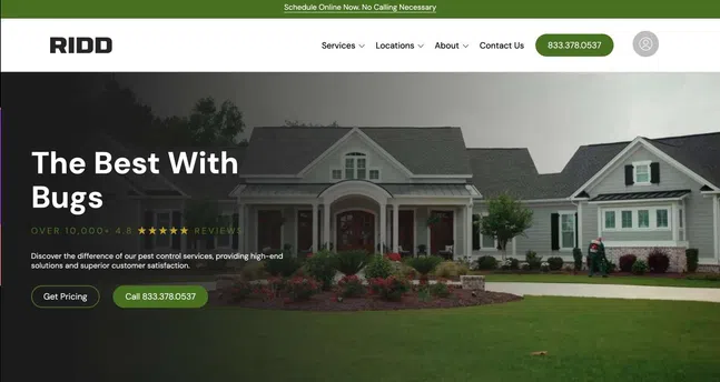 Large suburban house with well-maintained lawn and pest control technician in the background representing pest control services.