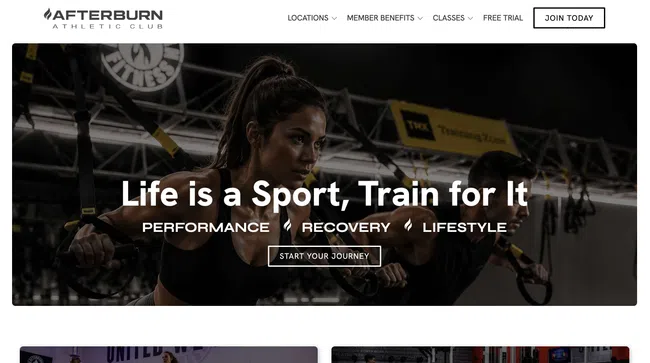 Woman performing suspension training exercise in gym with focus and intensity on face.