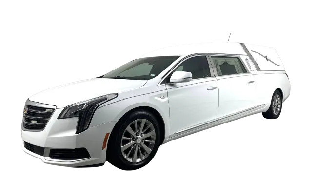 White Cadillac luxury hearse with extended body and tinted windows on a clear background.