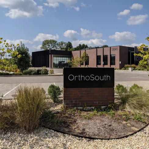 a sign in front of a building