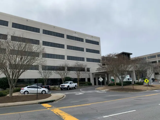 a building with cars parked in front