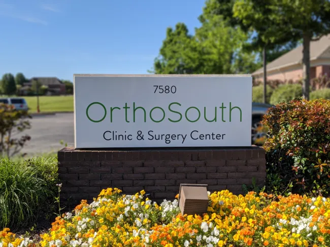 a sign in a garden