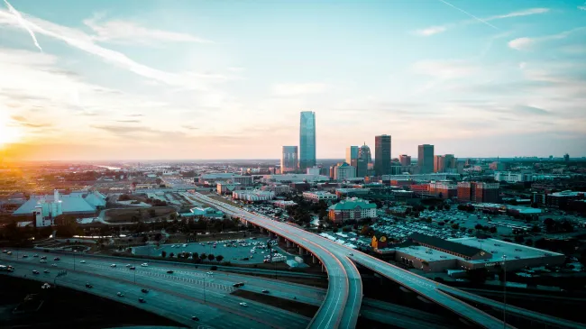 a city landscape with a freeway and buildings