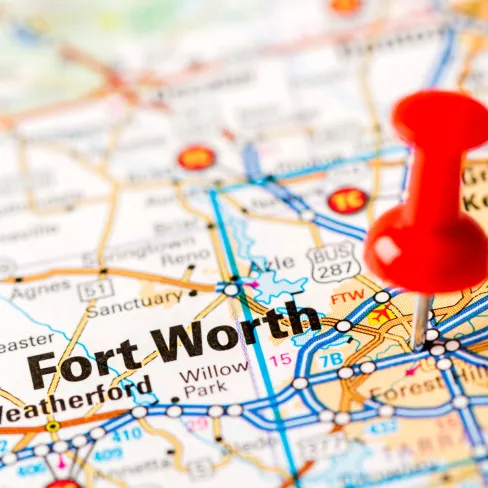Close-up of a map highlighting Fort Worth with a red pushpin.