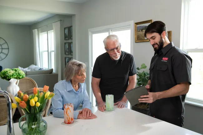 Portrait of a woman with frosted hair on a blue background with snowflakes and air conditioning company info.