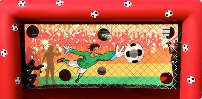 Inflatable soccer goal game with a goalkeeper diving to catch a ball and multiple soccer balls around the frame