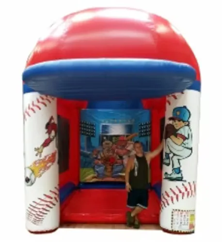 Man standing inside a red, white, and blue baseball-themed inflatable bounce house with cartoon baseball graphics.