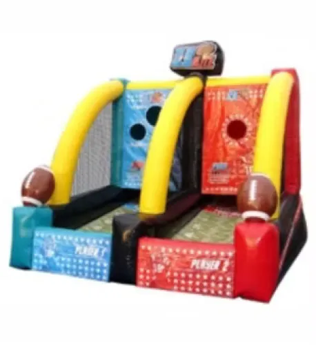 Inflatable football toss game with two lanes, yellow arches, and large football decorations at entrances.