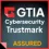GTIA Cybersecurity Trustmark Assured logo with red and yellow highlights on a dark background.
