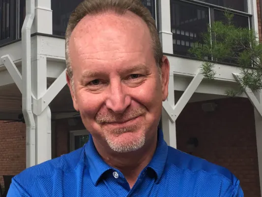 a man in a blue shirt