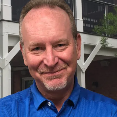 a man in a blue shirt