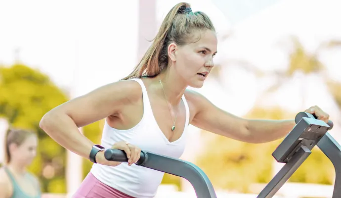 girl working out on an airbike