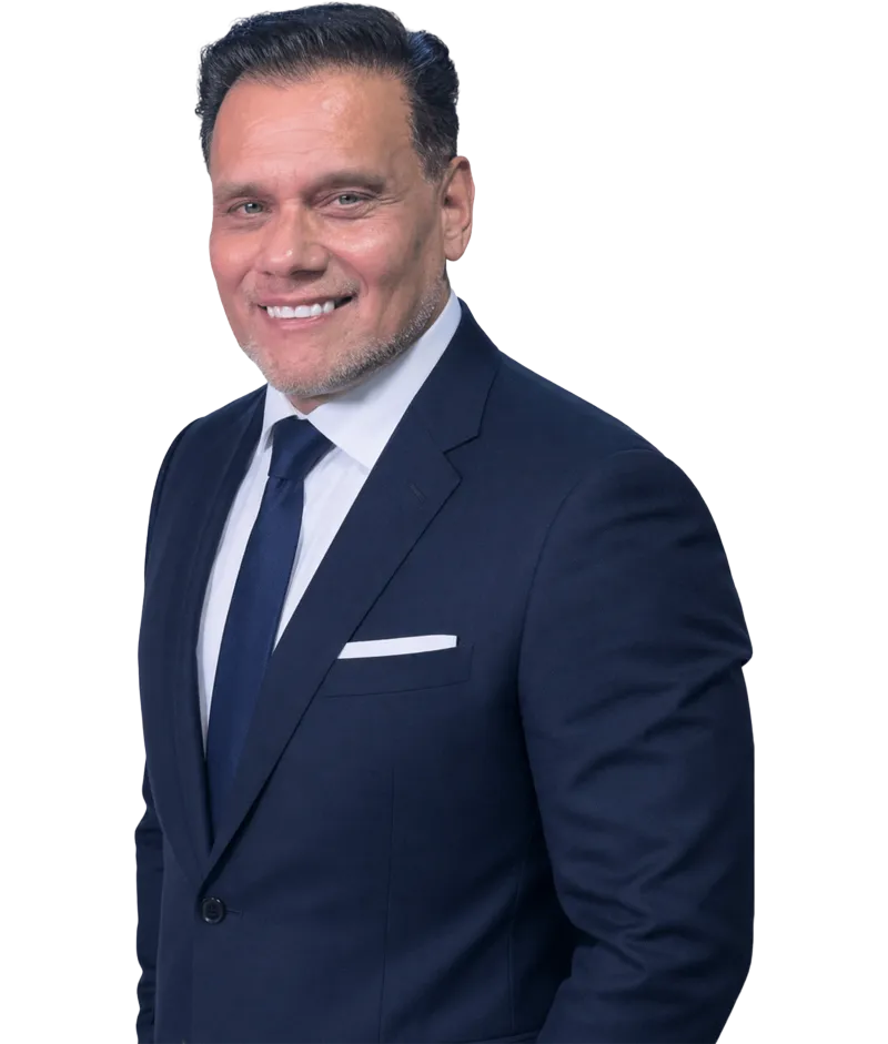 Smiling professional man in a navy blue suit with white shirt and tie