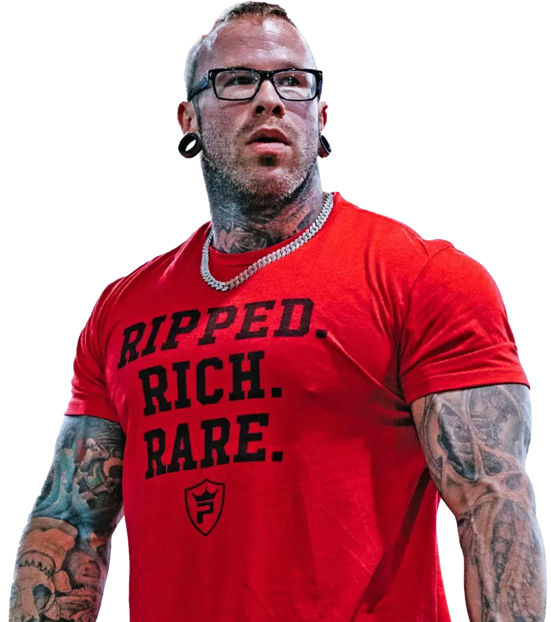 Muscular man with tattoos wearing glasses and a red shirt reading Ripped. Rich. Rare.