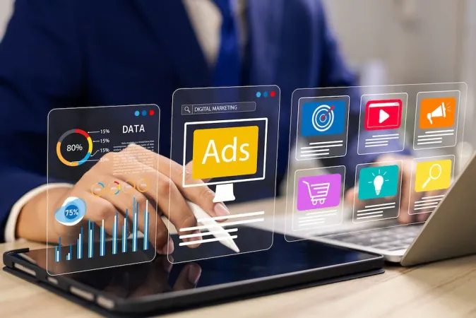 Person using tablet with digital marketing and data analysis virtual interface icons floating above device.