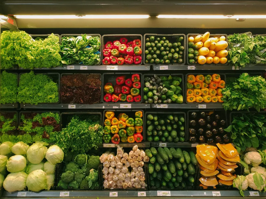 a bunch of different vegetables on display