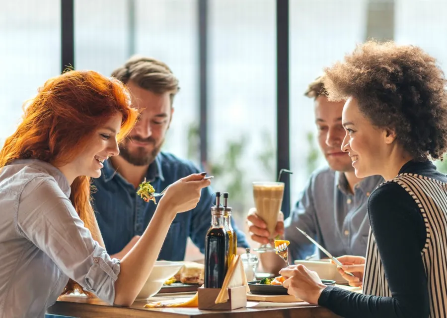 a couple of people sitting at a table