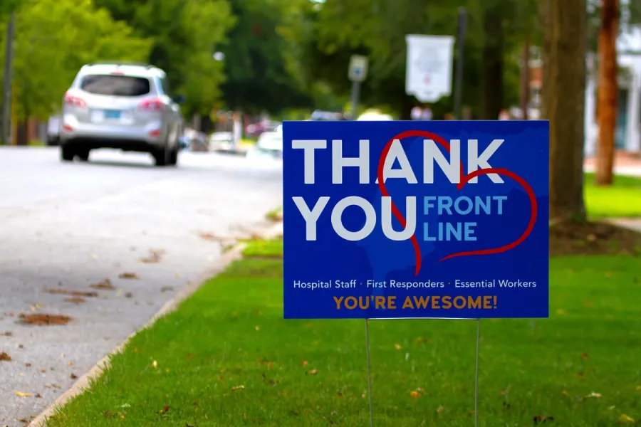 A plastic corrugated Sign on a lawn