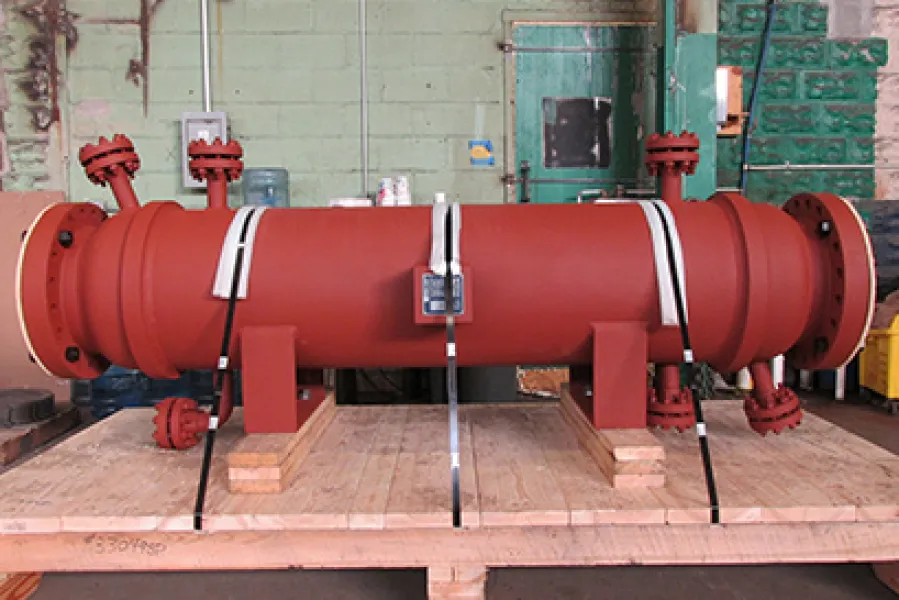 a red pipe with a metal tube