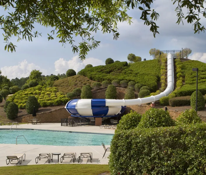 the fun waterslide at the community pool